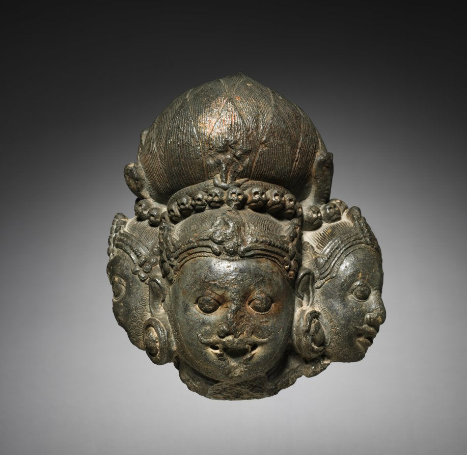 Stone sculpture of the three-faced form Trikala Bhairava