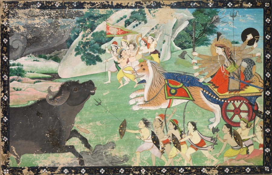 Durga rides a lion while confronting the buffalo demon Mahisha